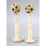 A PAIR OF 19TH CENTURY CHINESE CARVED IVORY FIGURES & PUZZLE BALLS - both figures stood holding