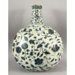 A MING STYLE BLUE AND WHITE MOONFLASK, decorated with peony and lotus flower, 45cm high, 35cm wide.