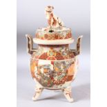 A JAPANESE SATSUMA TWIN HANDLE TRIPOD KORO AND COVER, the bowl painted with figures, the cover