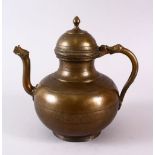 AN 18TH CENTURY MUGHAL INDIAN BRASS EWER, with animal formed handle and spout, 22cm high.