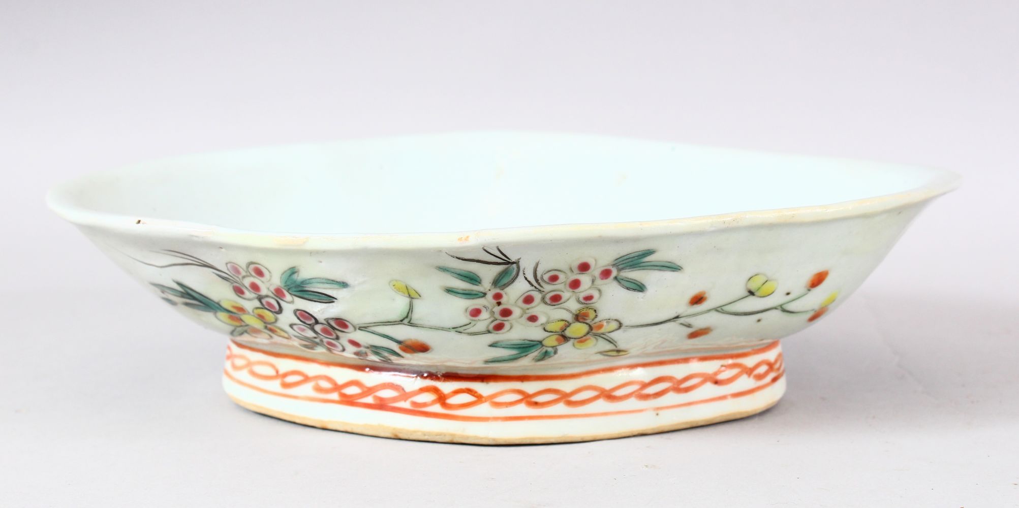 A 19TH CENTURY CHINESE FAMILLE ROSE PORCELAIN DISH - of elongated form, the exterior with decoration