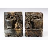 A PAIR OF CHINESE CARVED SOAPSTONE WALL HANGING PLAQUES - each carved in relief to depict displays
