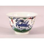 A CHINESE DOUCAI PORCELAIN HORSE CUP - depicting four horses amongst clouds, the base with a 6
