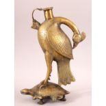AN UNUSUAL INDIAN BRASS HUQQA BASE, in the form of a bird standing on a turtle, 28cm high.