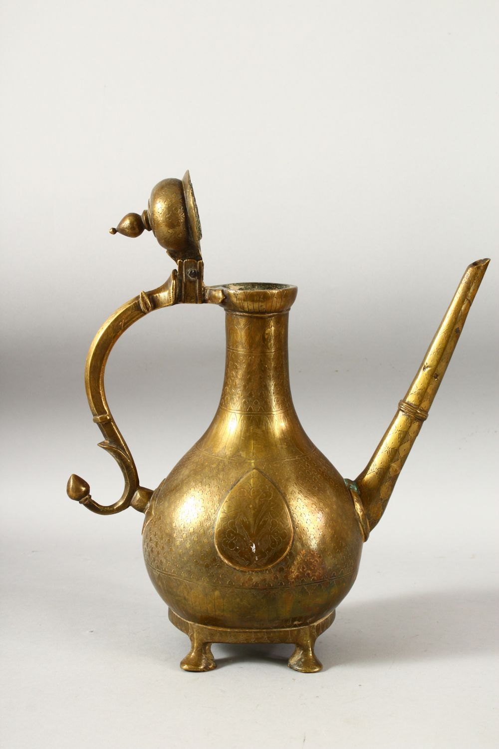 A LARGE 18TH CENTURY MUGHAL INDIAN BRASS EWER, with engraved / chased decoration, 32cm high. - Image 5 of 7