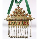 AN ISLAMIC CEREMONIAL NECKLACE with large metal pendant inset with semi precious stones, the pendant
