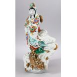 A JAPANESE MEIJI PERIOD KUTANI PORCELAIN FIGURE OF KWANNON & DRAGON - kwannon stood upon the back of