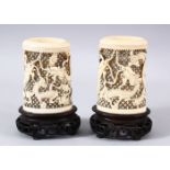 A PAIR OF 19TH CENTURY CHINESE CANTON CARVED IVORY OPENWORK VASES - each vase carved to depict