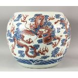 A VERY LARGE CHINESE DRAGON FISH BOWL, painted with iron red dragons and the flaming pearl of