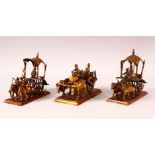 THREE 19TH CENTURY INDIAN METAL MODELS OF CARTS, each cart drawn by a variety of animals, largest