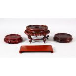 FOUR CHINESE CARVED WOODEN STANDS - 8cm - 8.9cm - 11cm ( circular stands) together with a