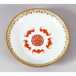 A CHINESE PORCELAIN SAUCER DISH, the dish painted with bats surrounding the longevity symbol, the