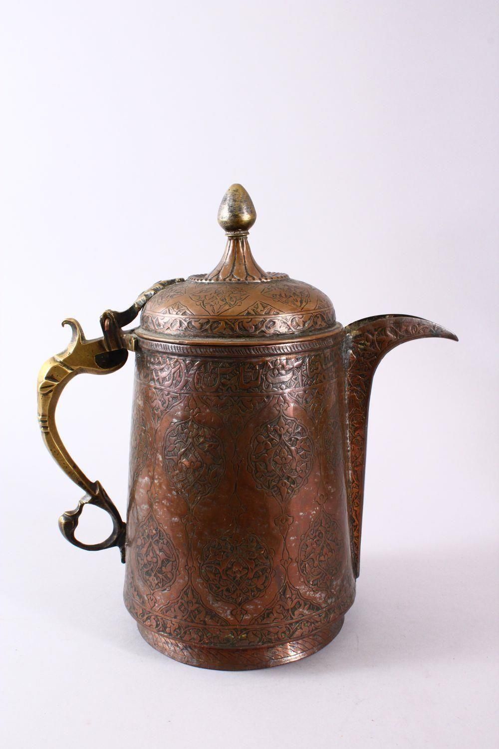 A 19TH CENTURY INDO PERISAN TINNED COPPER CALLIGRAPHIC JUG / EWER, the body with carved floral - Image 3 of 5