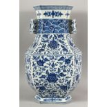 A CHINESE BLUE AND WHITE ZUN VASE, decorated with lotus flowers and floral motifs, 46cm high.