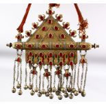 AN ISLAMIC CEREMONIAL NECKLACE with large metal pendant, the pendant 27cm x 21.5cm.