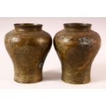 A RARE PAIR OF 18TH CENTURY DAMASCUS SILVER INLAID BRASS VASES - each with floral motif decoration