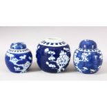 A LOT OF THREE CHINESE BLUE & WHITE PORCELAIN PRUNUS GINGER JARS, one with a cover -