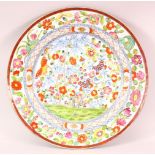 A GOOD 18TH/19TH CENTURY CHINESE PORCELAIN DISH, profusely painted with colourful flowers, 35cm