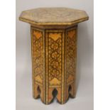 A 18TH/19TH CENTURY SYRIAN INLAID OCTAGONAL WOODEN TABLE, the top inlaid with exotic timbers and