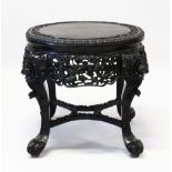 A SUPERB CHINESE CARVED EBONY STAND, the top border carved with bamboo, cherry blossom and lilies