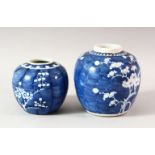TWO BLUE AND WHITE PRUNUS GINGER JARS, lacking covers,14cm and 10cm.