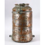 AN ISLAMIC TINNED COPPER FOUR TIER STORAGE VESSEL - engraved with stylized decoration, with a top