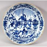 AN EARLY 20TH CENTURY CHINESE BLUE & WITE PORCELAIN DISH - decorated with figures in garden settings