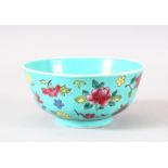 A CHINESE TURQUOISE GLAZED PORCELAIN BOWL - the turquoise ground with floral famille rose