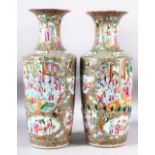 A PAIR OF CHINESE CANTON PORCELAIN VASES, painted with panels of predominantly female figures,