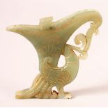 A CHINESE CARVED GREEN JADE PENDANT of a libation cup and bird, 10cm x 10.5cm.