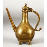 A LARGE 18TH CENTURY MUGHAL INDIAN BRASS EWER, with engraved / chased decoration, 32cm high.