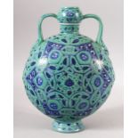 A CHINESE TURQUOISE GROUND TWIN HANDLE PORCELAIN MOON FLASK - the body decorated with geometric