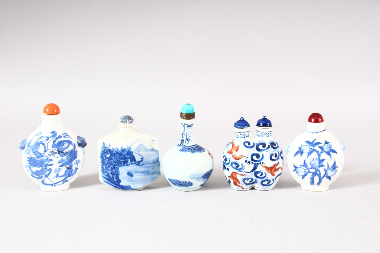 A MIXED LOT OF 5 CHINESE BLUE & WHITE PORCELAIN SNUFF BOTTLES - each with a varied subject, peach - Image 2 of 3