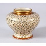 A JAPANESE MEIJI PERIOD SATSUMA SQUAT FORMED VASE - The small vase with millefluer style floral