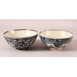 TWO EARLY CHINESE BLUE AND WHITE SHIPWRECK PORCELAIN BOWLS, (af), 14.5cm diameter.