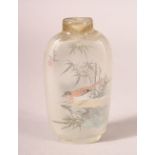 A CHINESE GLASS SNUFF BOTTLE, internally painted with birds, signed, lacking stopper, 8cm high.