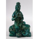 A CHINESE SONG STYLE TURQUOISE GLAZED FIGURE OF GUYANYIN - seated upon her elephant - the