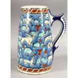 AN IZNIK STYLE GREEK POTTERY JUG, painted with deer and rabbits, 22cm high.