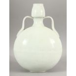 A CHINESE BLANC DE CHINE TWIN HANDLE MOONFLASK, with curving handles, 33cm high, 22cm diameter.