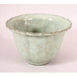 A CHINESE CRACKLE GLAZE CELEDON BOWL, 15cm diameter.