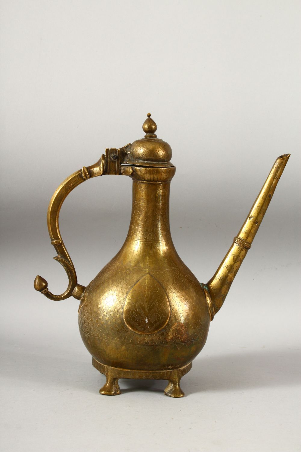 A LARGE 18TH CENTURY MUGHAL INDIAN BRASS EWER, with engraved / chased decoration, 32cm high. - Image 3 of 7