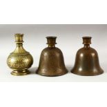 THREE INDIAN BRASS HUQQA BASES, each with engraved / chased decoration, tallest 17.5cm (3).