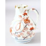 A JAPANESE ARITA PORCELAIN OIL JUG / EWER, painted with flowers, 12cm high.