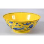 A CHINESE YELLOW GROUND PORCELAIN FISH BOWL - decorated with a yellow ground and scenes of fish