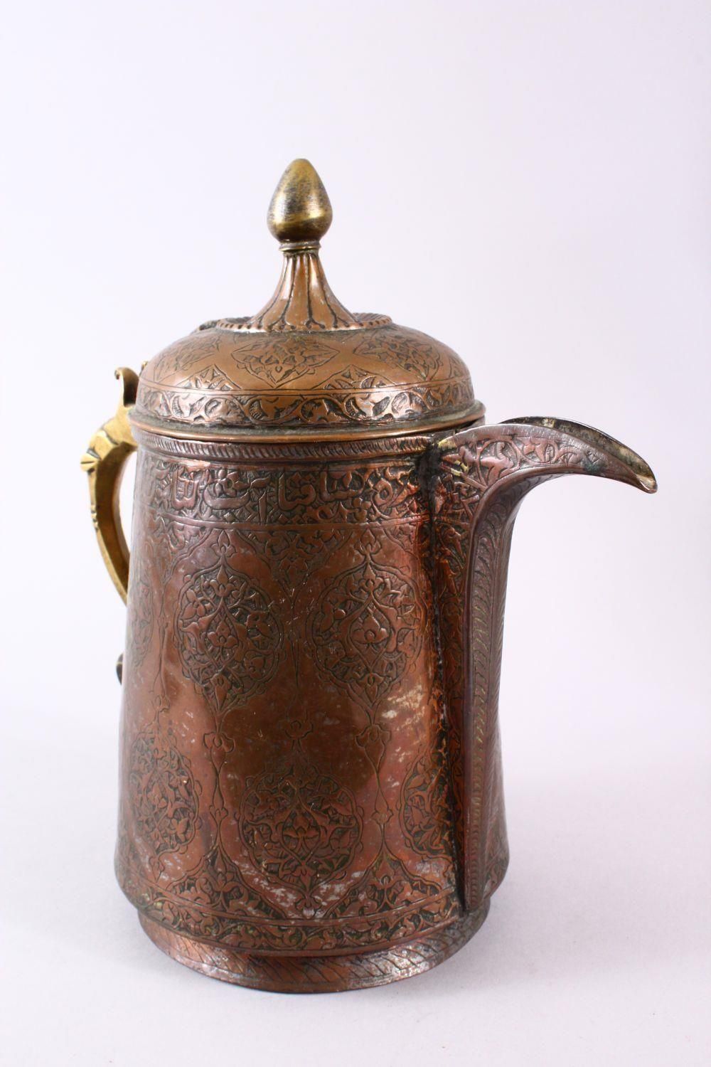 A 19TH CENTURY INDO PERISAN TINNED COPPER CALLIGRAPHIC JUG / EWER, the body with carved floral - Image 2 of 5