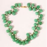 A CHINESE JADEITE AND SEED PEARL NECKLACE, each stone approx. 15mm.