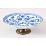 A CHINESE KANGXI PERIOD BLUE & WHITE PORCELAIN DISH / STEM DISH - the blue and white dish mounted