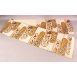 A FINE QUALITY JAPANESE EMBROIDERED SILK FUKURO OBI TIE, with a beige ground and floral and gilt