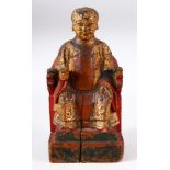 A CHINESE CARVED WOOD & LACQUER FIGURE OF A SEATED BOY - the boy sat upon23cm a chair leaning,