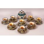 A SET OF EIGHT PALETINIAN JERUSALEM POTTERY COFFEE CUPS AND SAUCERS, together with a sugar bowl,